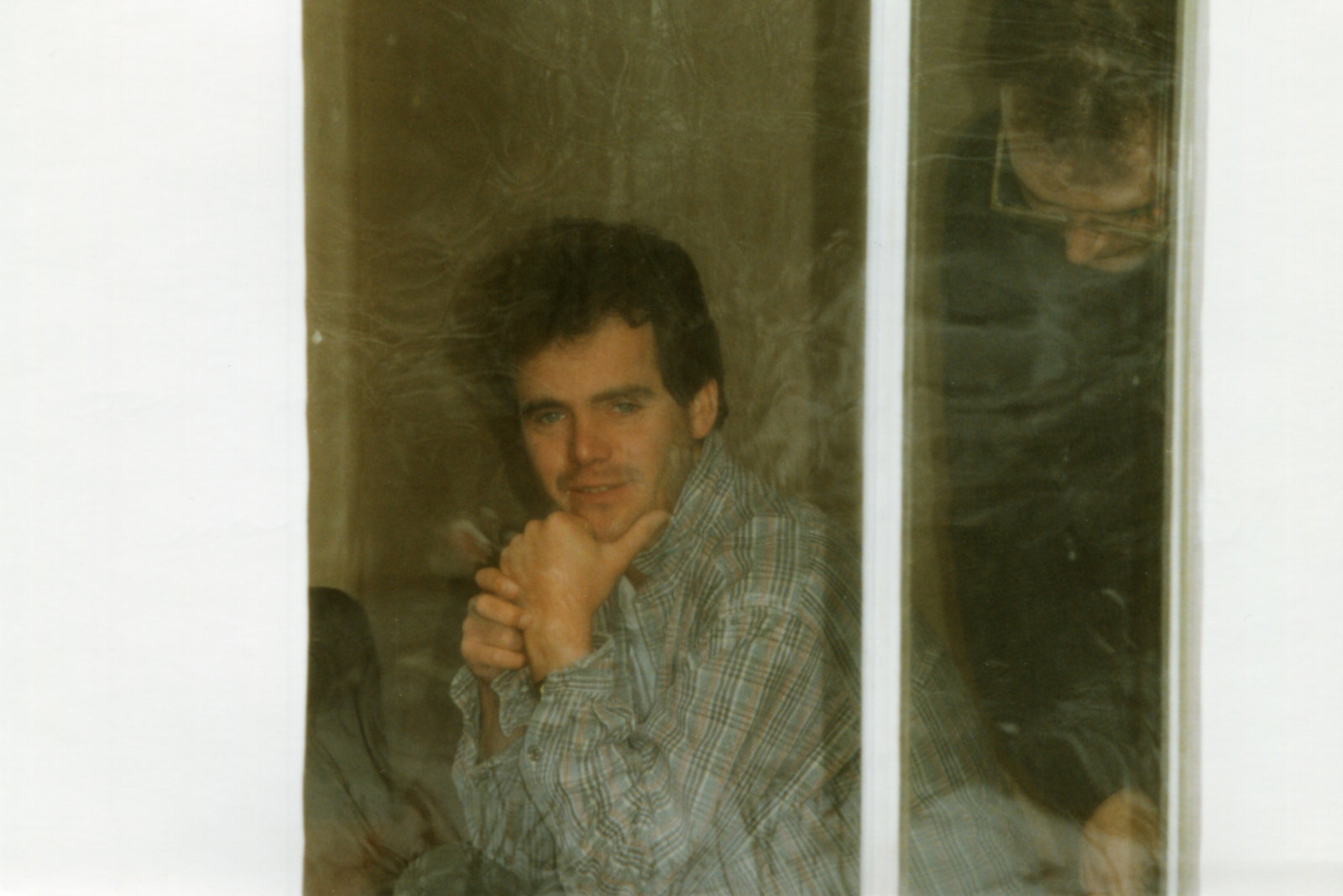 Photo with The Seeds of Time lead singer and guitar player Alastair James Thompson looking through the studio window